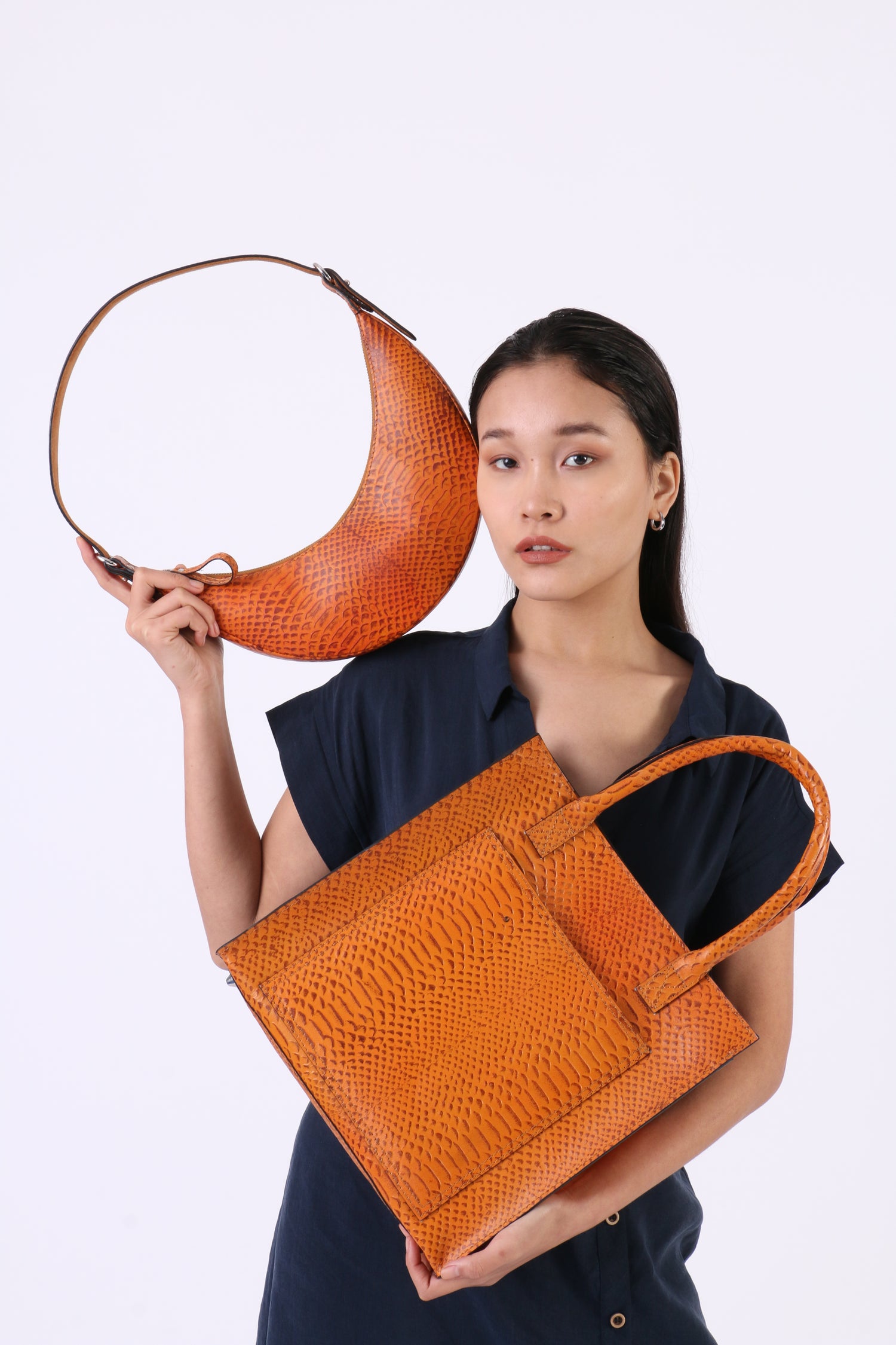 model with custom handbags